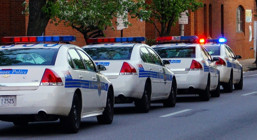 Baltimore Police cars driving in a line