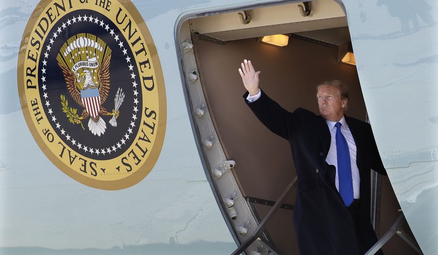 President Donald Trump waves while boarding Air Force One for a trip to Vietnam to meet with North Korean leader Kim Jong Un, Monday, Feb. 25, 2019, in Andrews Air Force Base, Md. (AP Photo/ Evan Vucci)