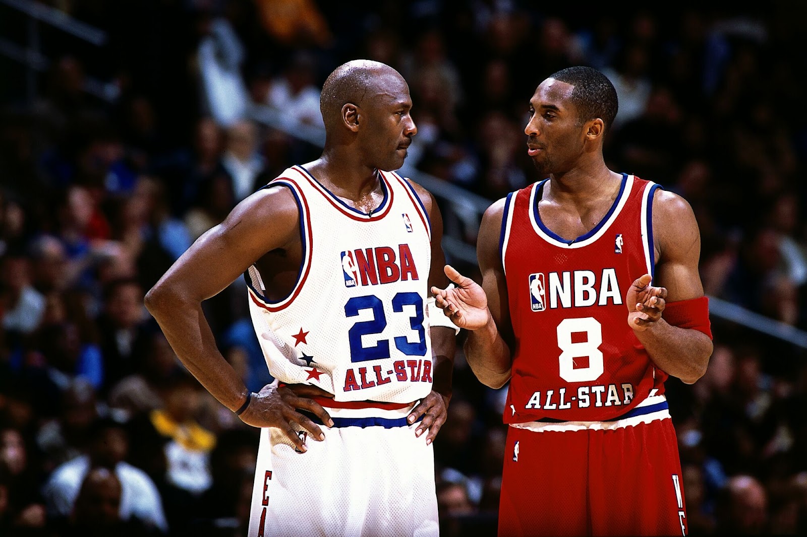 Kobe Bryant talks to Michael Jordan during the 2003 NBA All-Star game.