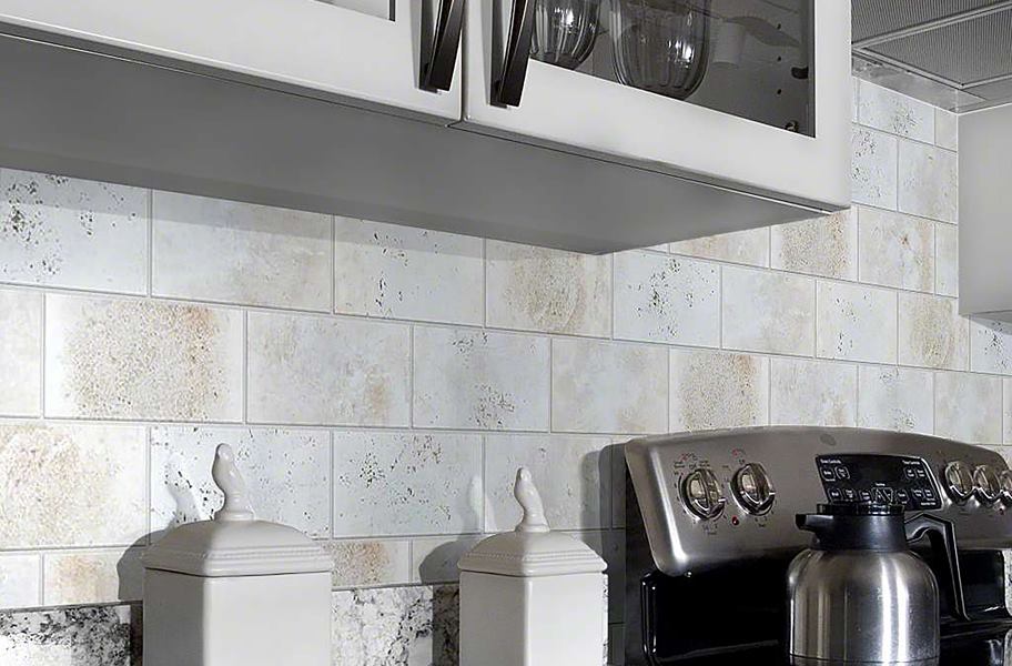 textured white subway tile as kitchen backsplash