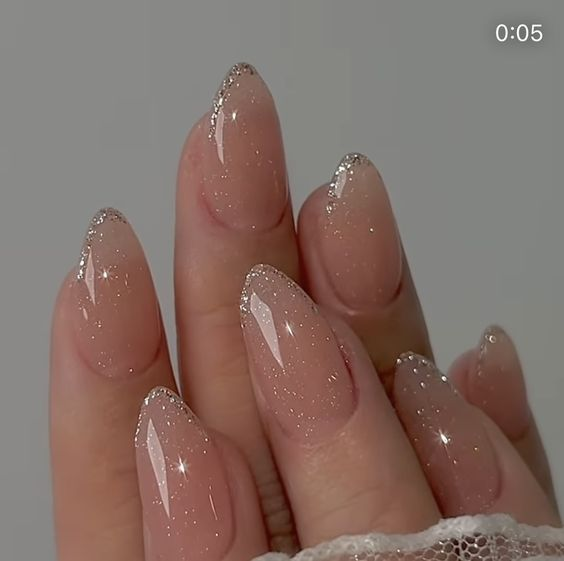 Another gorgeous look of the minimal nail with glittery crystals on it