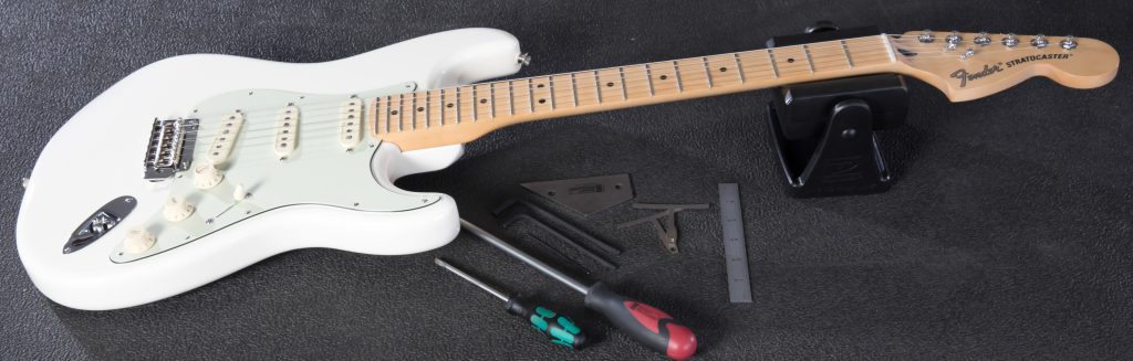 Fender Strat on workbench next to tools