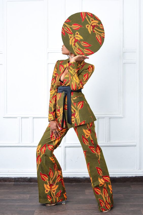 Woman in matching suit and ankara hat