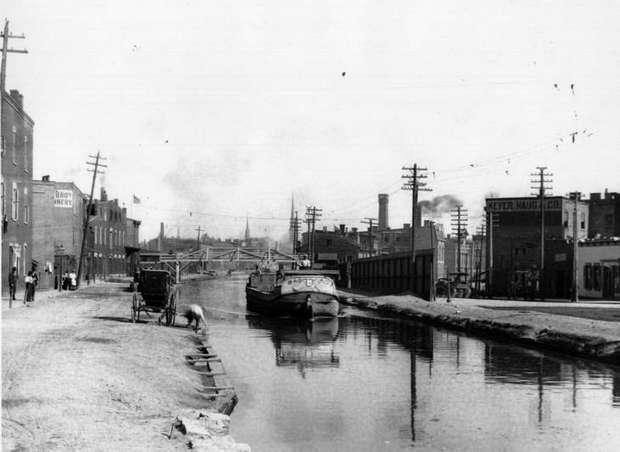 A canal boat from Carthage heading south past Mohawk bridge in  Over-the-Rhine.