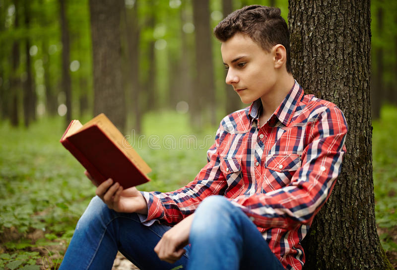 Teenager reading a book stock image. Image of portrait - 41891143
