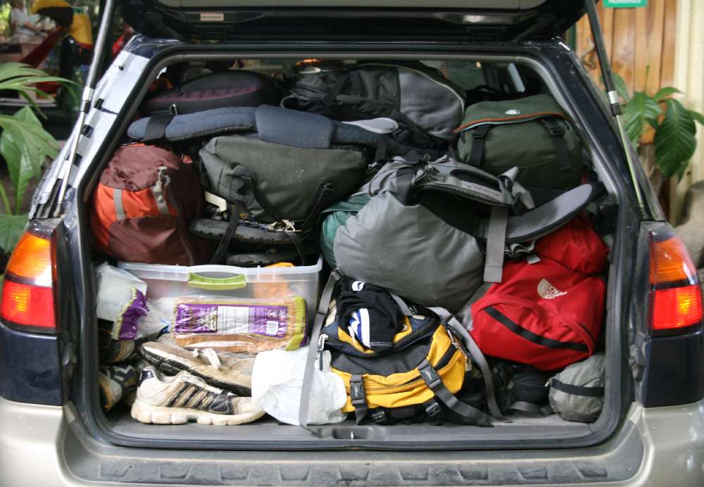 Car boot packed full with luggage