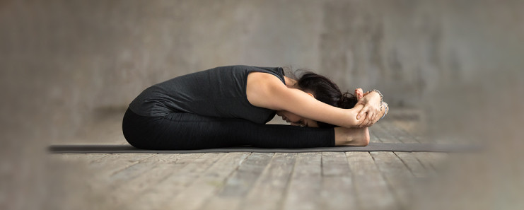 Paschimottanasana stretches the hamstrings, calves, and spine.