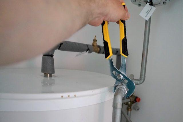 A man fixing his water heater. So, why not avoid all the risks of putting off plumbing repairs and call the experts right away? You'll save yourself from lots of trouble and stress, and on the bottom line, you'll also save money.