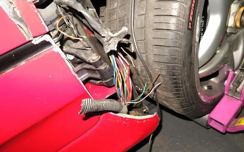 damage to a high-performance Ferrari F50 shown in court