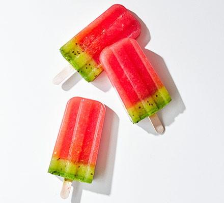 Three watermelon lollies on a white background