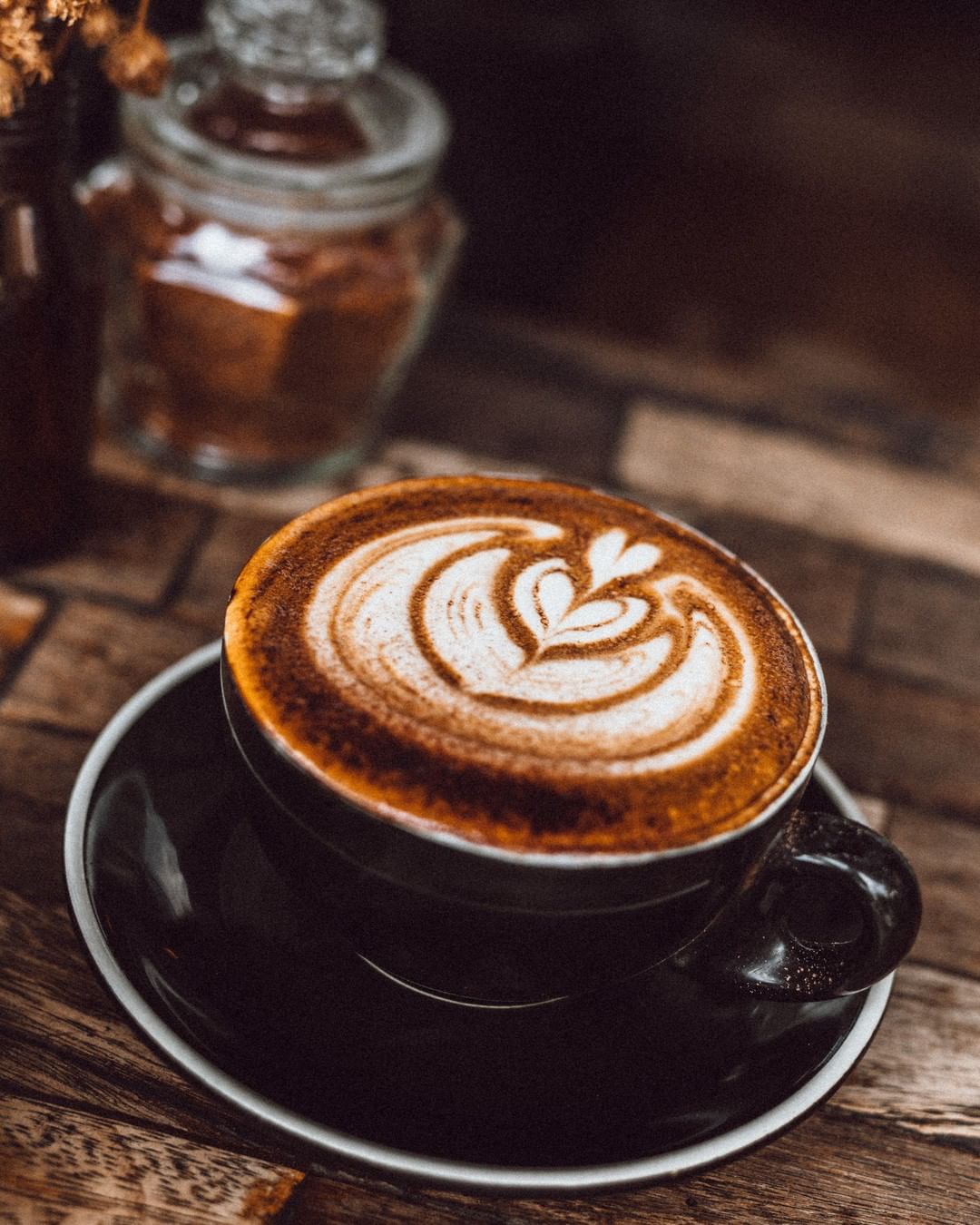 A cup of rich coffee with pretty latte art at Revolver Expresso 