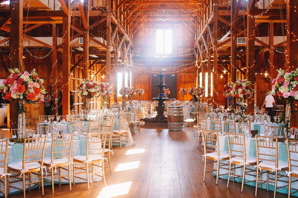 white-daylight-illuminates-wooden-hangar-prepared-wedding