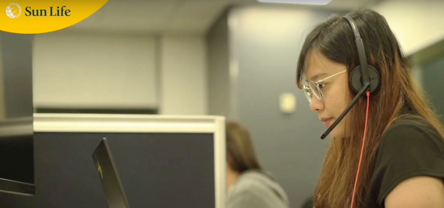 A person wearing glasses and a headset looking at a computer screen

Description automatically generated