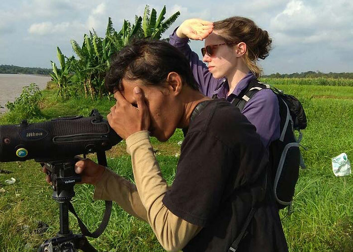 Imam and Sarah scanning shorebirds at Kali Progo estuary, Jogja