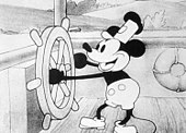 A cartoon mouse is operating a ship's steering wheel