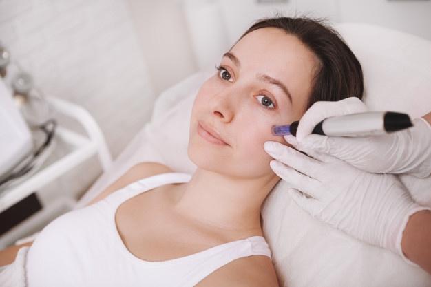 Young woman getting facial skincare treatment