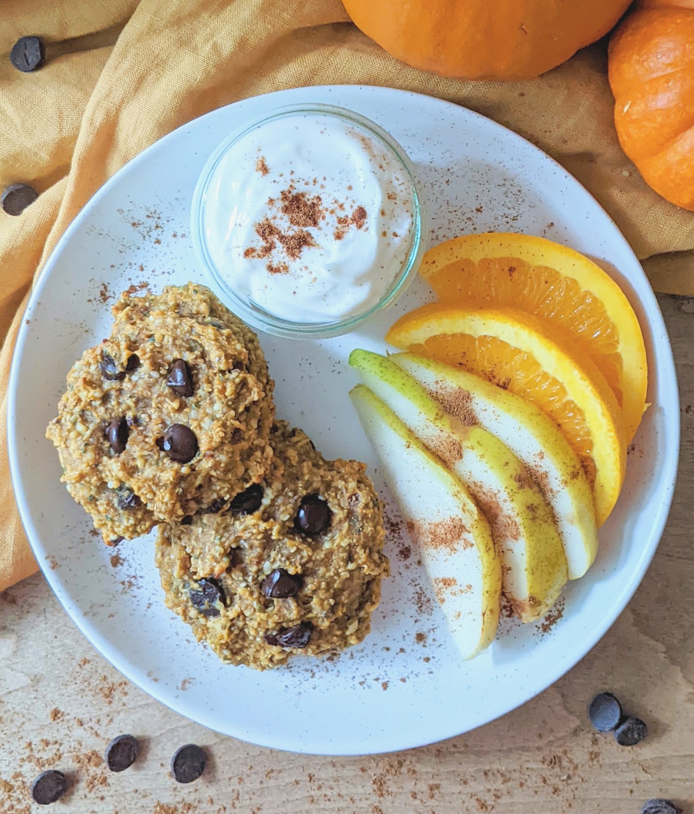 top down view of breakfast cookies in a plate with fresh fruit