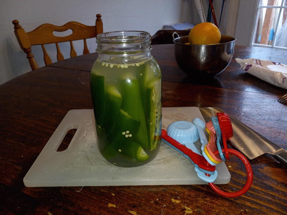 Pack your jalapeños (and celery if included) into the quart jar, it will be a tight squeeze, but this is what you want. Fill with water until it covers the tops of the jalapeños.