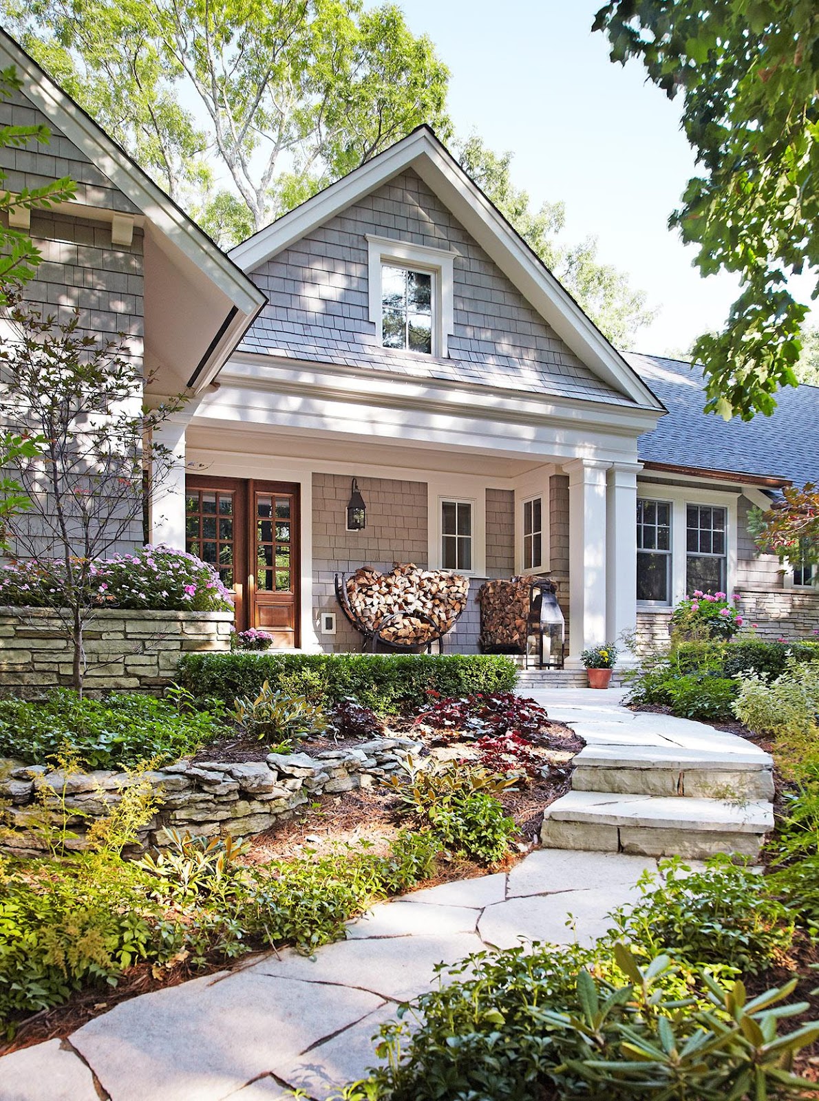 WeServe Front of house with stone stairs surrounded by plants 