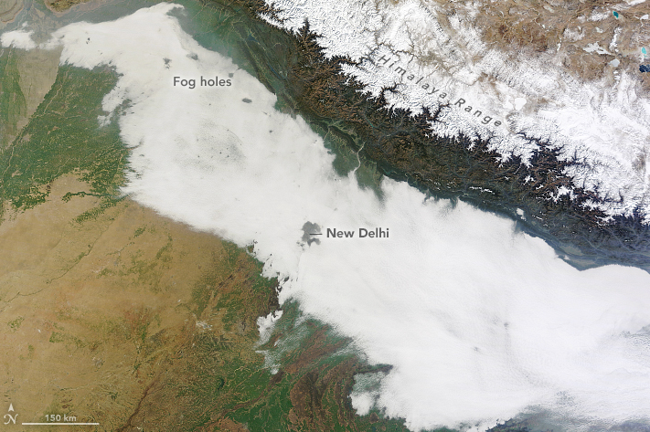 Image: Holes in a layer of fog over northern India | Credit: NASA Earth Observatory