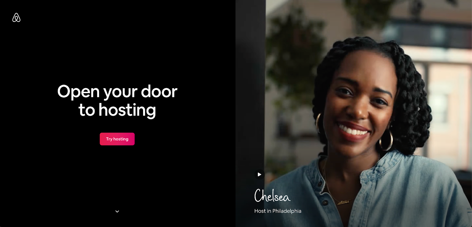 A black background with a white heading in the middle "Open your door to hosting". Underneath a pink CTA button that says "Try hosting".