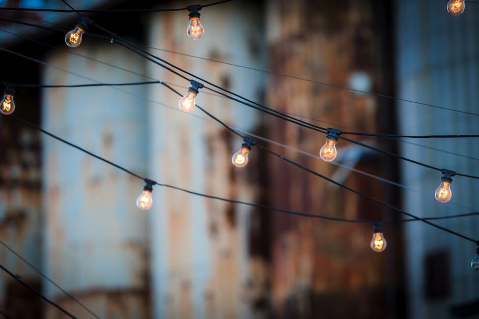 Close-up of Illuminated Lighting Equipment Against the Sky