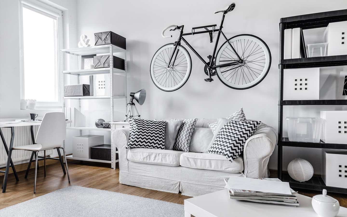 studio apartment bicycle stored on wall