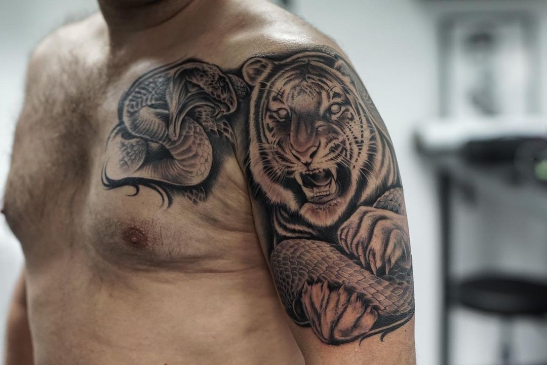 Black Tiger And Snake Shoulder Tattoo