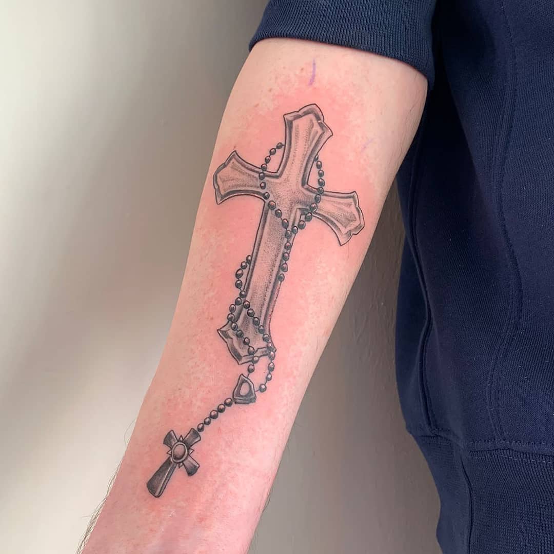 rosary tattoo on arm