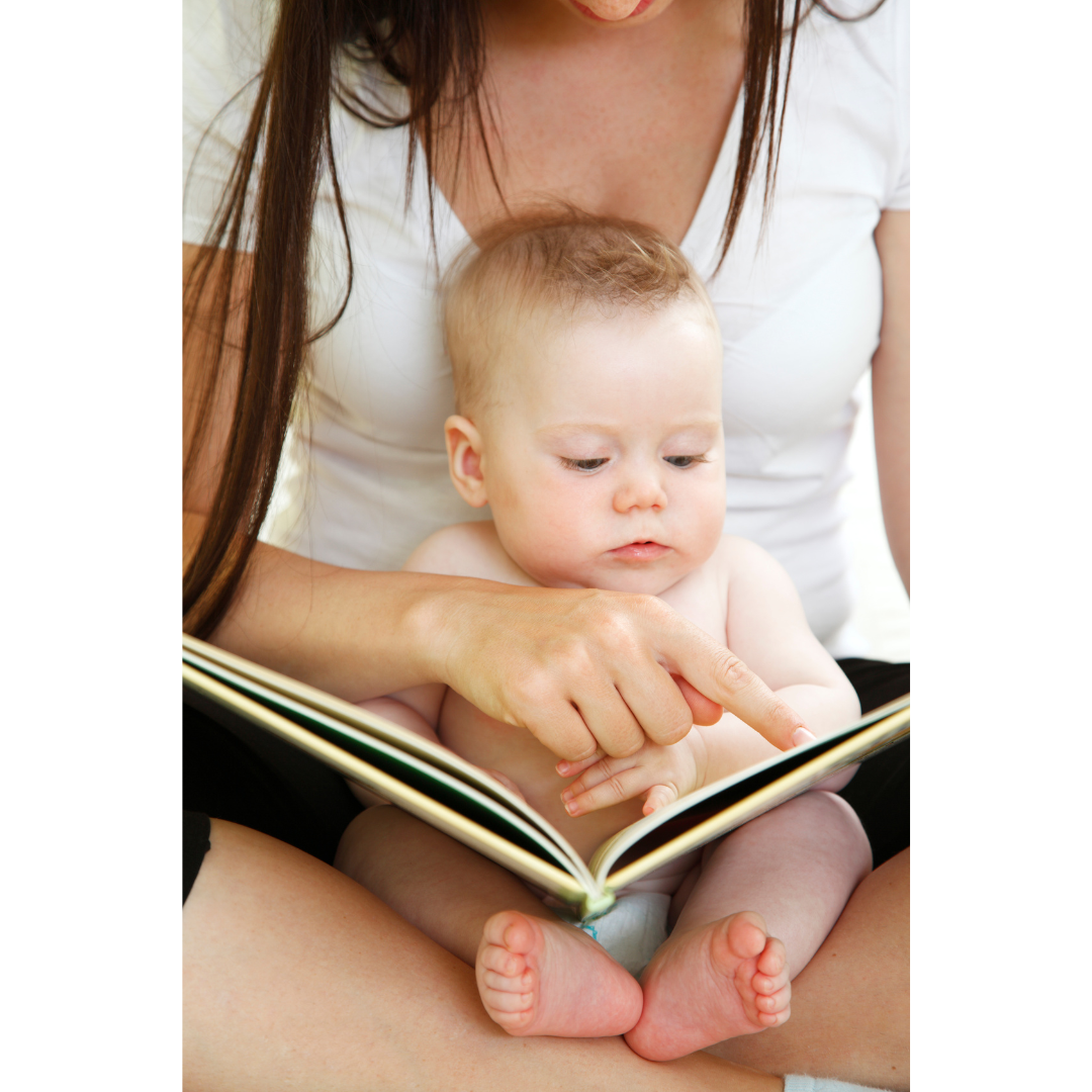 Mother reading a book to her baby