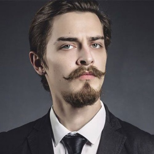 Picture showing a man rocking the look with a Russian mustache 