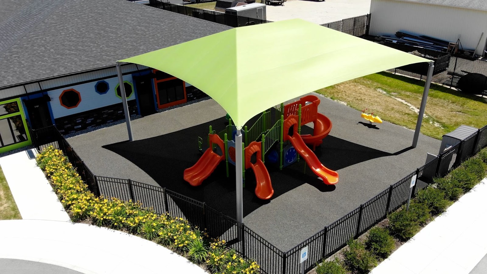 fabric shade structure over a playground