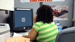 Giphy clip of woman staring at a computer screen until an email comes in, and then falling off her chair in shock.