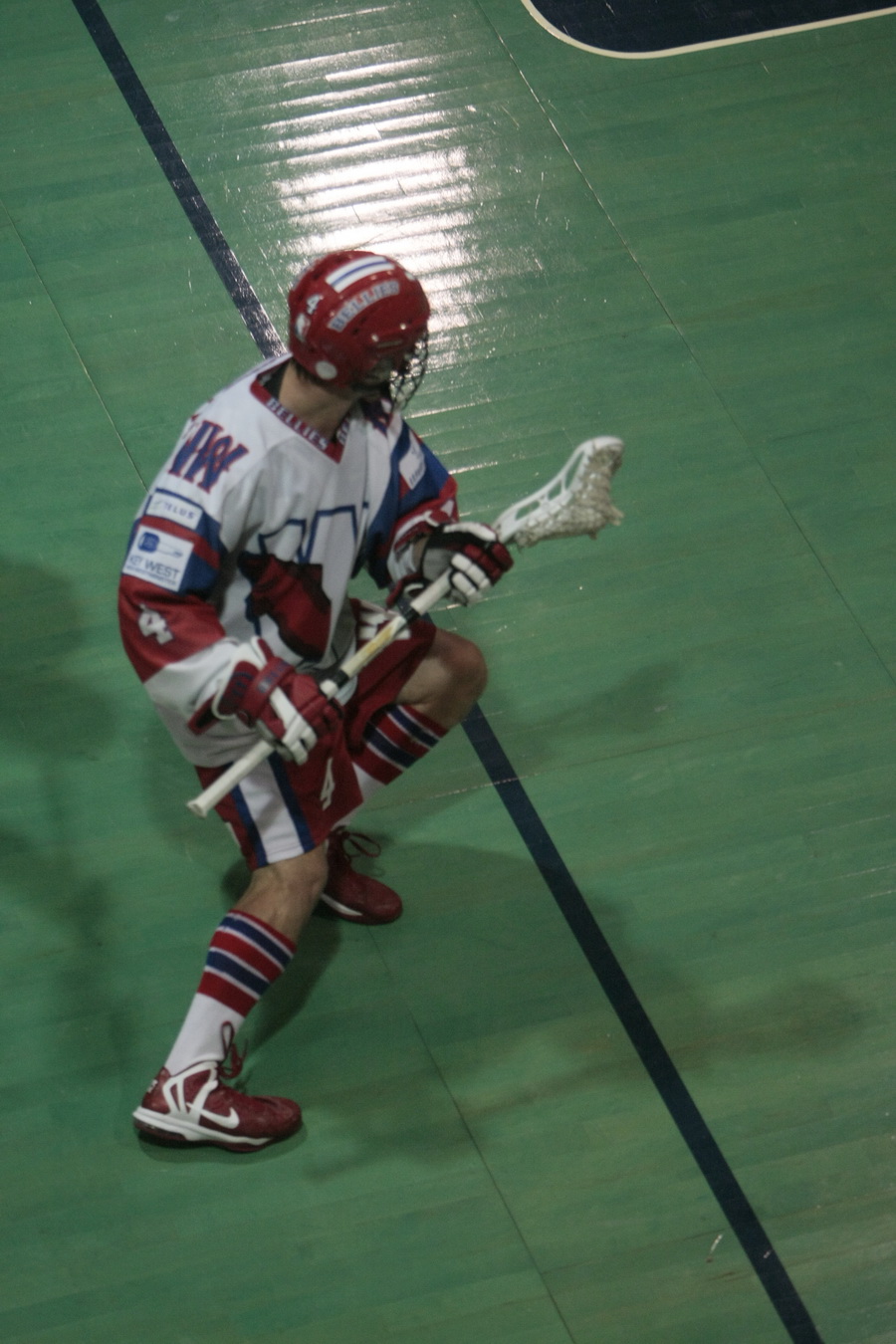 Chet Koneczny pro lacrosse player performing a roll dodge