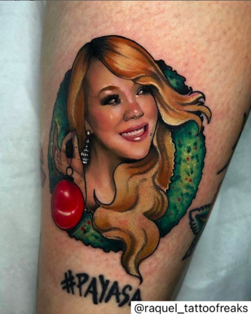 Mariah Carey Holding Christmas Light Tattoo