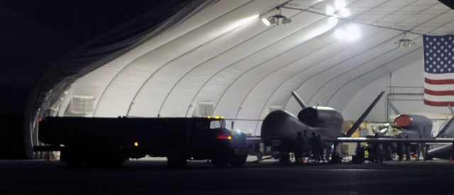 A U.S. Air Force RQ-4 Global Hawk drone aircraft assigned to the 380th Air Expeditionary Wing is being refueled during operations on the flight line of an undisclosed base in Southwest Asia in this file image from Jan. 10, 2010.  (REUTERS/Tech. Sgt. Scott T. Sturkol-US Air Force/Handout/Files)