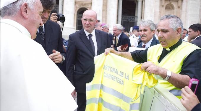 Father José Aumenté presents Pope Francis with a reflective vest of the Spanish bishops' highway ministry. Photo courtesy of Fr. José Aumenté.