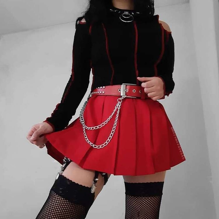 Punkdesign clothing including short red skirt, chains and collar