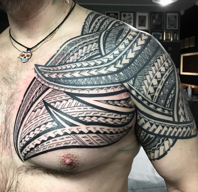 Mens Tribal Chest Tattoo Idea