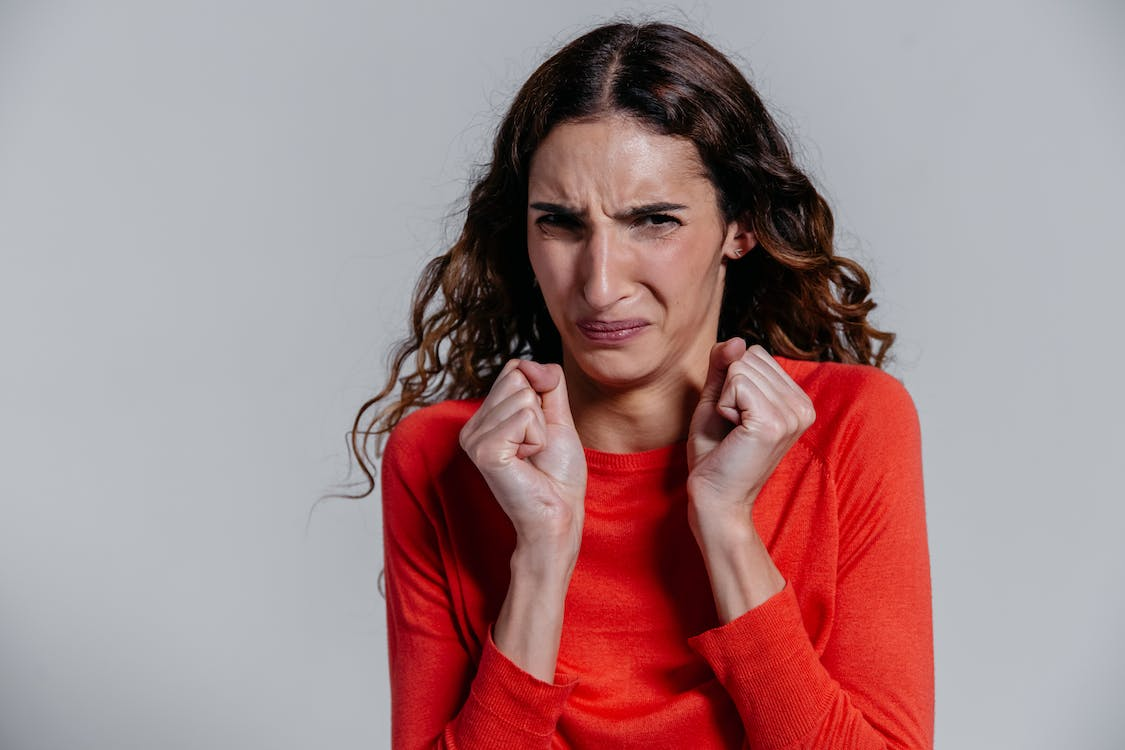  Woman makes “ick face” in the absence of replacement toilet seat covers.