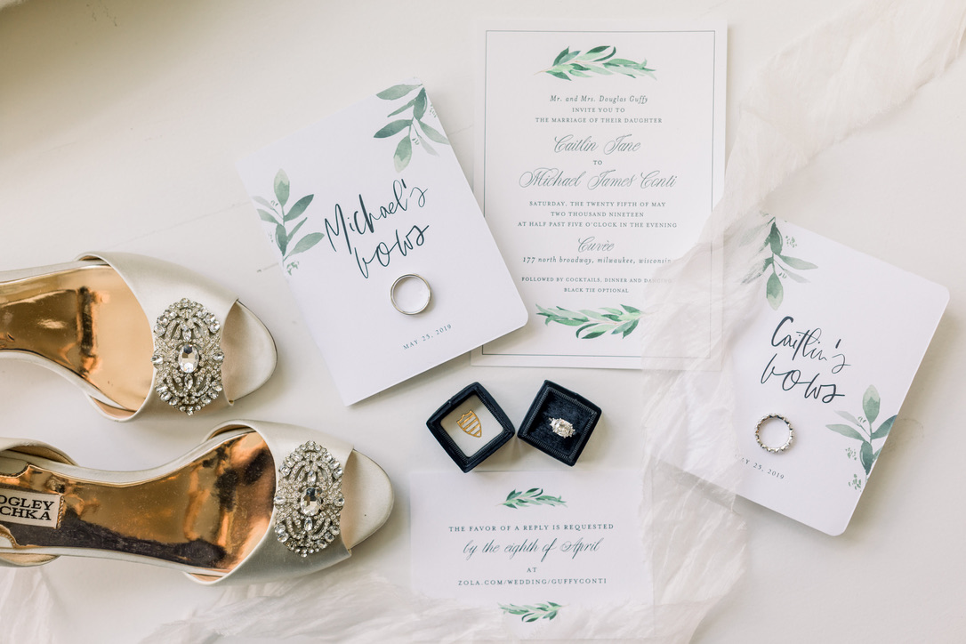 wedding invitation suite with bride's shoes and rings