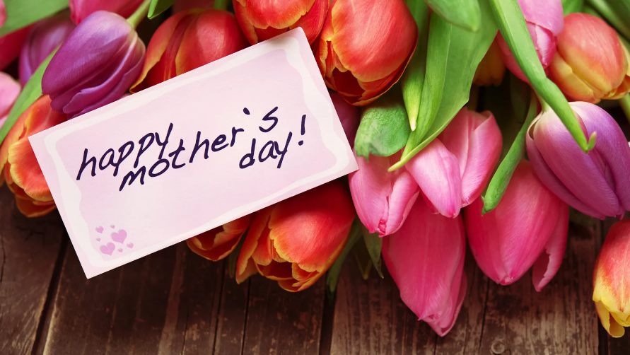 A fresh bunch of tulips with a "happy mother's day!" card