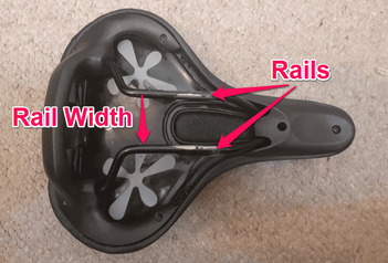 The rail width of a mountain bike saddle is the width between the two rails under the saddle.