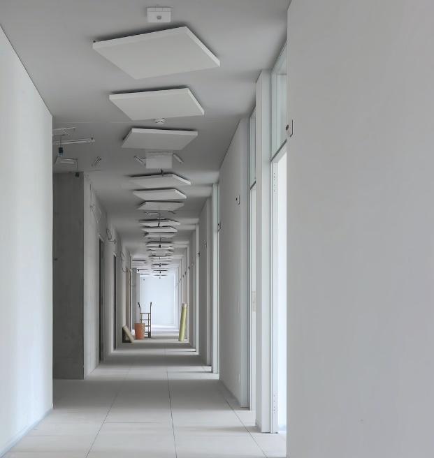 A white corridor under construction.