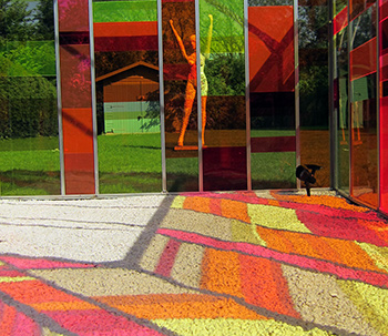 Inside a greenhouse showcasing multi-coloured acrylic panels