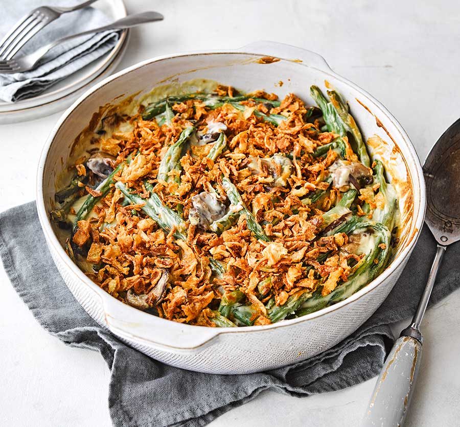 Casserole dish of green beans mixed with mushrooms, rice, and other ingredients