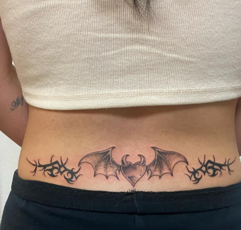 Heart Of Bat Lower Back Tattoo