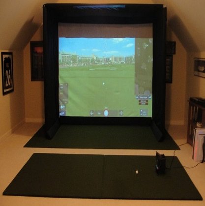 complete golf simulator setup with hitting mat and enclosure