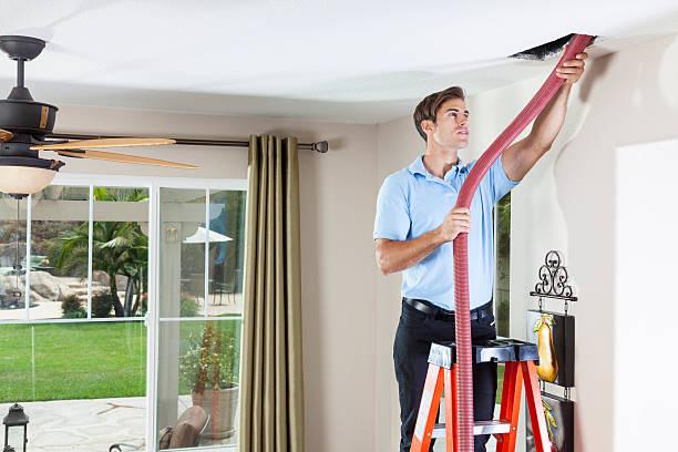 WeServe Man Cleaning The Ducts