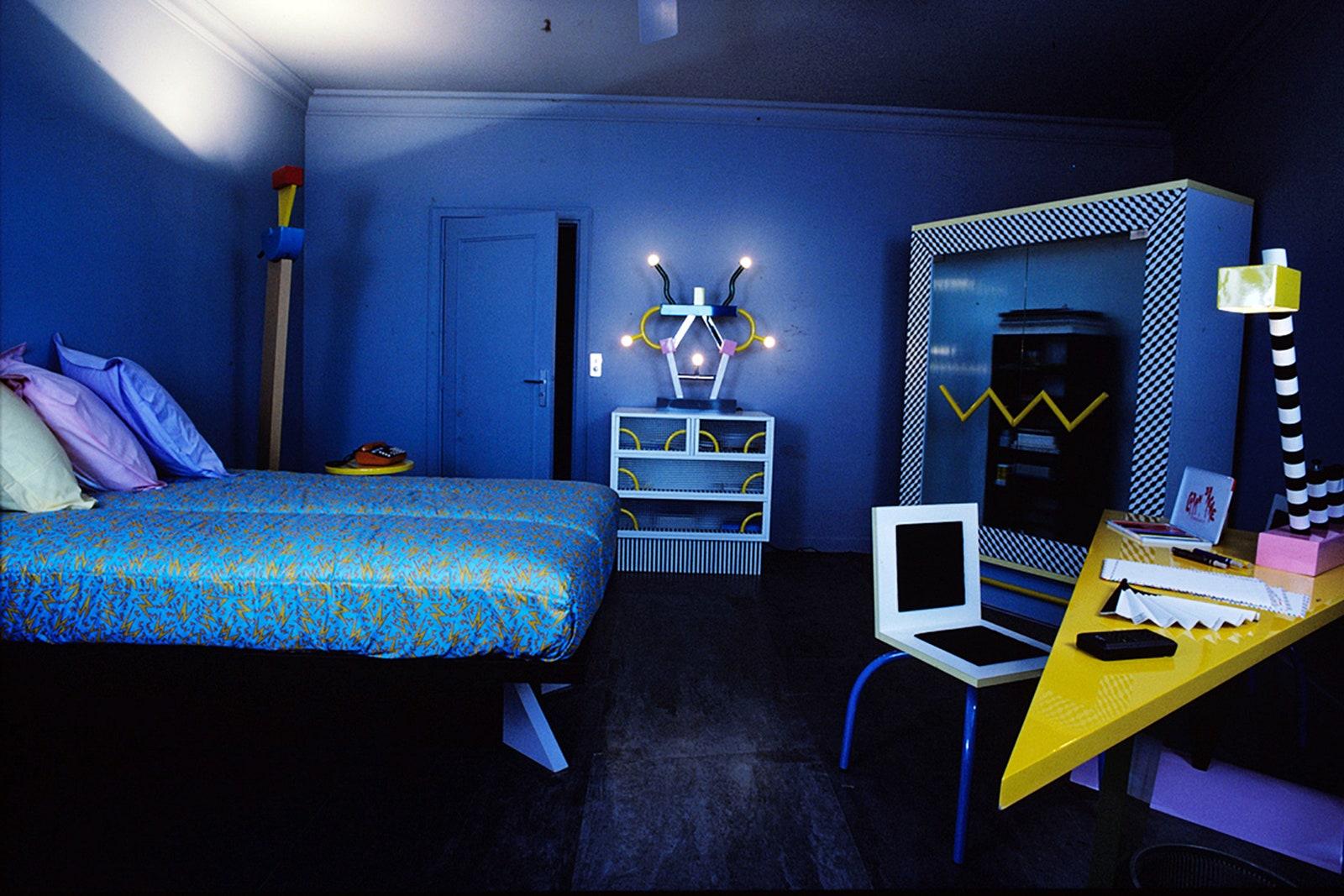 Image may contain Indoors Room Bedroom Furniture Bed Flooring and Dorm Room